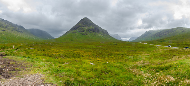 Beautiful landscape with Glencoe or Glen Coe mountains. An beautiful view over landscape in the Scottish Higlands, Scotland. UK. View of the Hidden-valley in the Scottish Highlands.