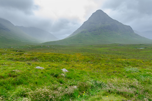 Beautiful landscape with Glencoe or Glen Coe mountains. An beautiful view over landscape in the Scottish Higlands, Scotland. UK. View of the Hidden-valley in the Scottish Highlands.