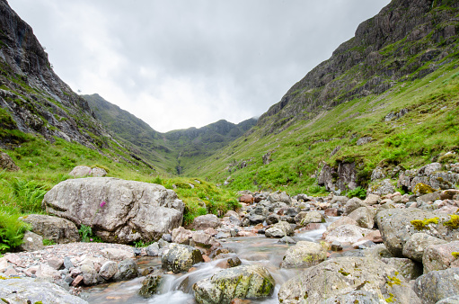 Beautiful landscape with Glencoe or Glen Coe mountains. An beautiful view over landscape in the Scottish Higlands, Scotland. UK. View of the Hidden-valley in the Scottish Highlands.