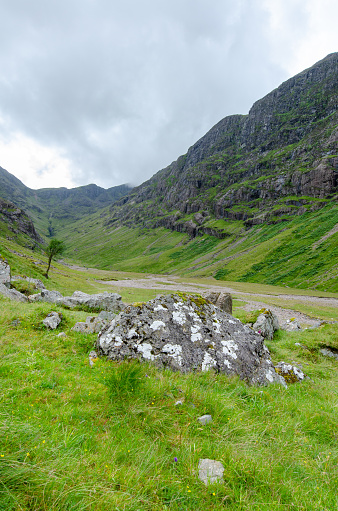 Beautiful landscape with Glencoe or Glen Coe mountains. An beautiful view over landscape in the Scottish Higlands, Scotland. UK. View of the Hidden-valley in the Scottish Highlands.