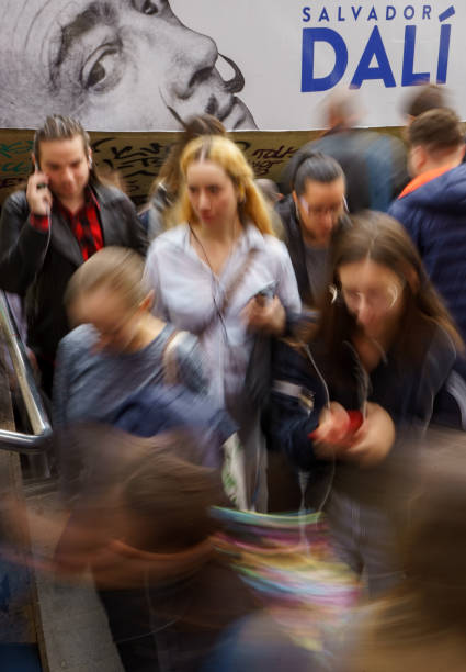 Bucharest, Romania. 2st Nov, 2023: People pass under the banner of the largest exhibition, in Romania, of authentic works by the famous artist Salvador Dali The Universe of Salvador Dalí