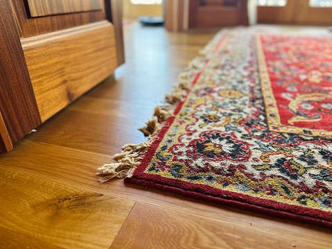 A background of fine Asian rugs.