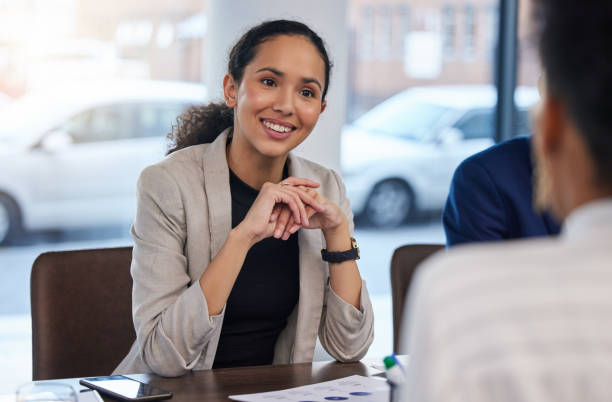 job interview, happy and woman in office for business meeting, discussion and networking with candidate. we are hiring, smile and friend hr lady explaining hiring process, recruitment and our vision - our lady of africa imagens e fotografias de stock