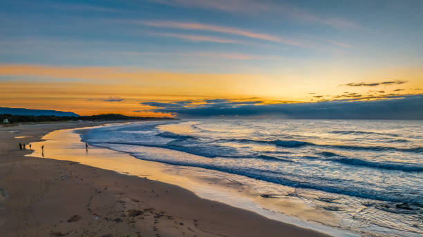 istock Sunrise seascape with waves 1797543320