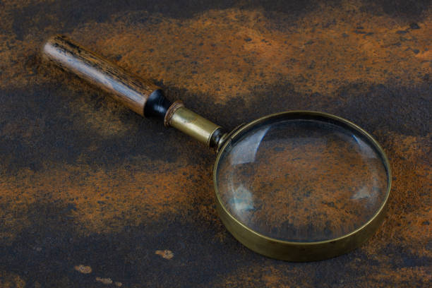 istock Vintage magnifying glass on metal rusty background, 1797568332