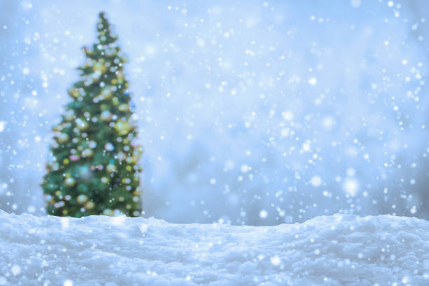 istock Empty white snow with blur Christmas tree with bokeh light background 1797570573