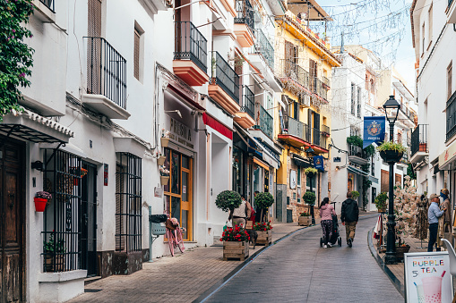 Marbella, Malaga, Spain - November 4, 2023: City streets of Marbella in Costa del Sol, Spain. The Old Town, iconic streets in Marbella and major tourist attractions with shops and bars at city centre