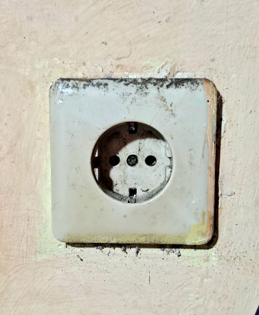 Picture of dusty old eletrical outlet