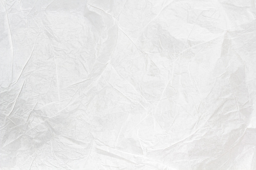 white crumpled paper texture background. White cloth texture crease the fabric