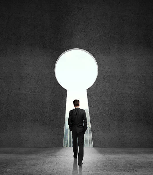 istock Businessman walking towards a keyhole 179761050