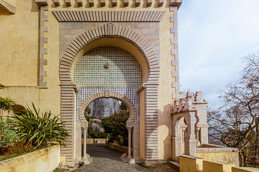 Sintra, Portugal -  December 15, 2018: close up of one of the arches over a passage at the Palacio da Pena ( Pena Palace ) in Sintra, Portugal.