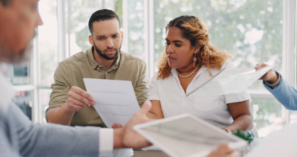 istock Business people, documents or teamwork in a meeting, planning and feedback for budget report, finance and data analysis. Staff, coworkers or group with paperwork, proposal or conversation with review 1797657530