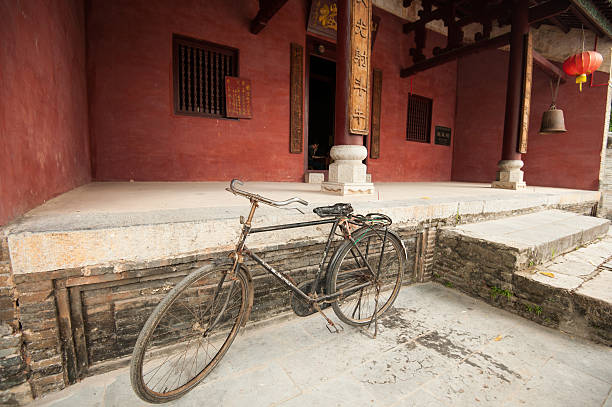 istock Old bicycle parked in front of an ancient temple, China 179765873