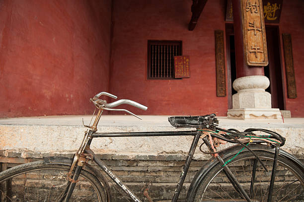 istock Old bicycle parked in front of an ancient temple, China 179765889