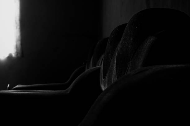 A sofa in the dark exposed to window light
