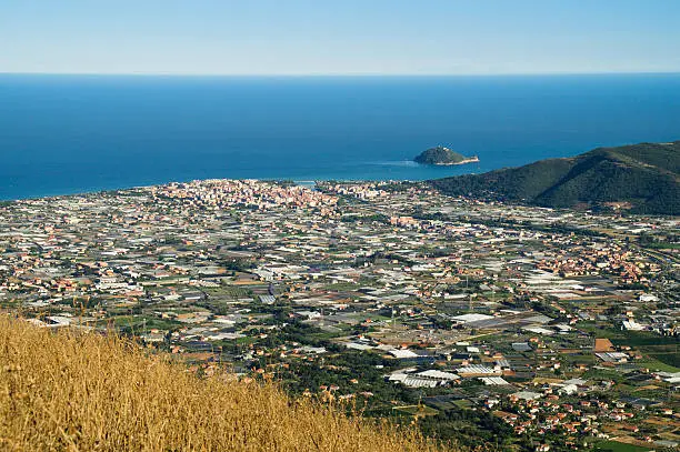 Wide view of the city of Albenga and the Gallinara island