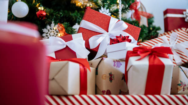 istock Neatly wrapped gift boxes beneath the contemporary Christmas tree in home, Xmas 1797726949