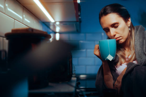 istock Sick Woman Drinking a Tea at Home in the Kitchen 1797746565