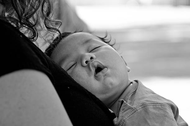 istock Baby boy sleeping with mommy 179776192