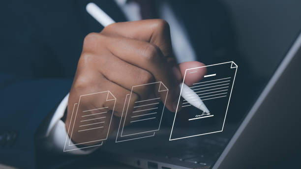 istock Man uses pen sign electronic documents on virtual screen. Electronic signature. 1797776384