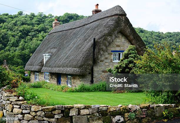 Thatched Cottage In Yorkshire England Stock Photo - Download Image Now - Cottage, England, Thatched Roof