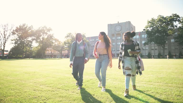 Female friends arrive at university