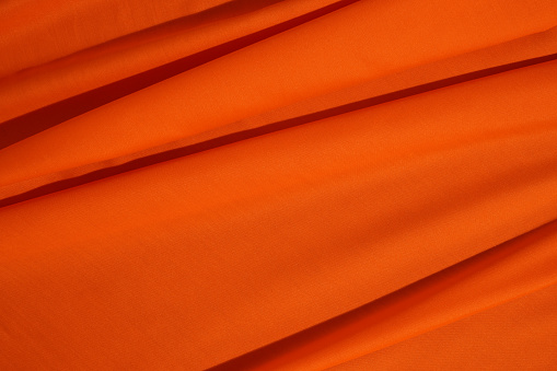 Wrinkled Orange Fabric Texture Background