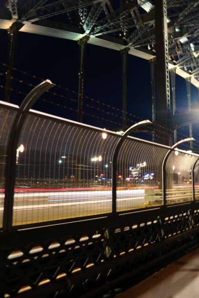 Traffic light trails on the iconic Sydney harbour, bridge. It is the sixth longest spanning-arch bridge in the world and the tallest steel arch bridge, measuring 134 m from top to water level, on Sydney harbour, Australia.