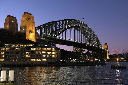 The iconic Sydney harbor bridge. It is the sixth longest spanning-arch bridge in the world and the tallest steel arch bridge, measuring 134 m from top to water level, on Sydney harbor, Australia.
