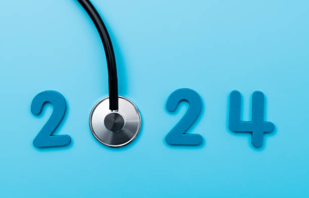 Stethoscope and number 2024 on blue background