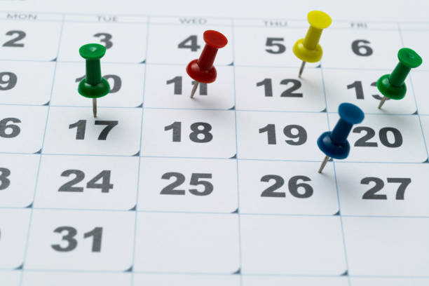 istock Thumbtack pins on a calendar 1797924668