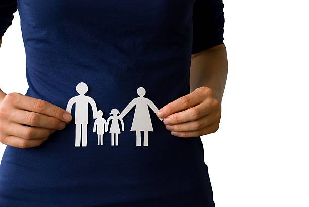 istock hands holding a paper chain family 179801185
