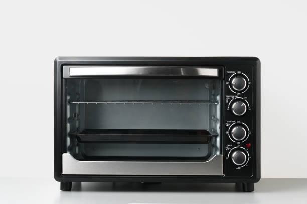 istock Electric mini oven on gray background studio shot 1798014827