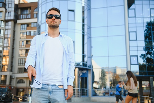 Blind man. Visually impaired man with walking stick