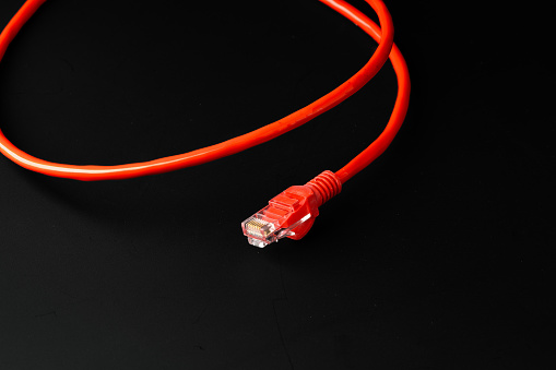 Network cable on black background studio shot close up