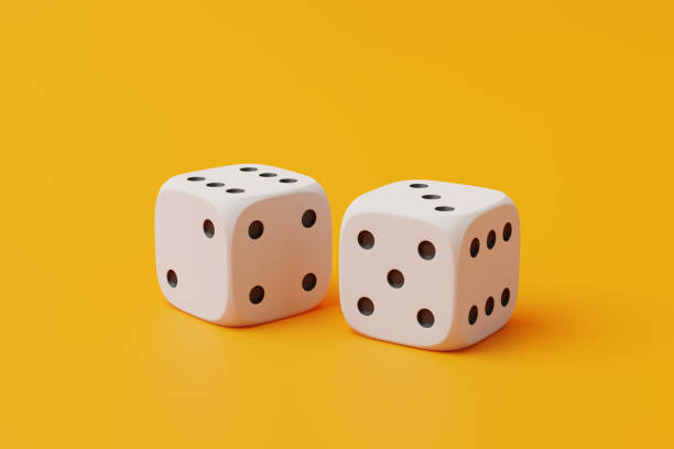 istock Two white rolling gambling dice on a yellow background 1798025100