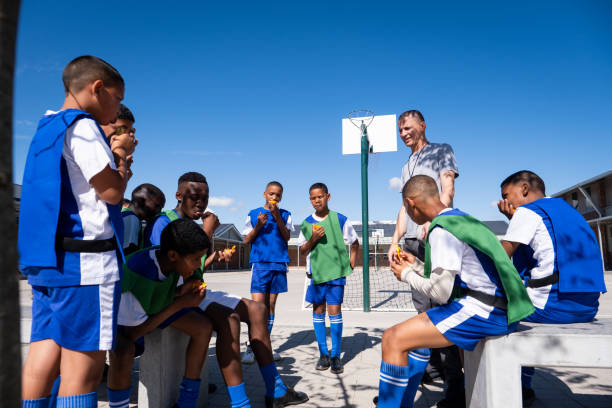 istock Soccer boys enjoy healthy oranges for their half time snack 1798036376