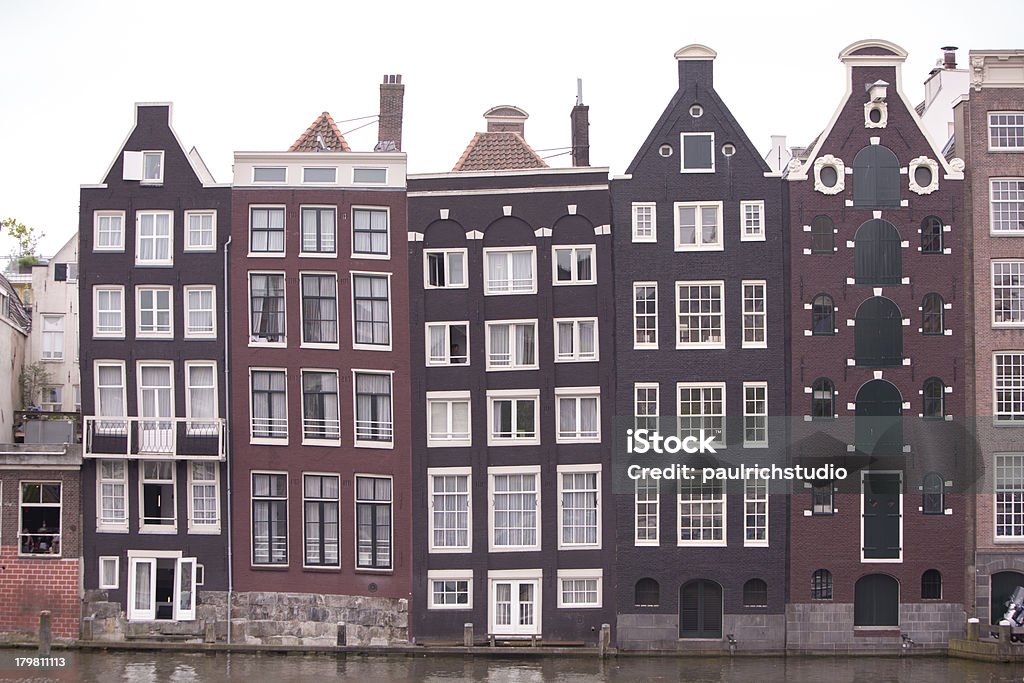 Traditional houses of Amsterdam, The Netherlands amsterdam, ancient, antique, architecture, attraction, building, canal, city, classic, construction, day, destination, dutch, europe, european, historic, holland, house, landmark, netherlands, old, outdoor, picturesque, river, scene, scenic, sightseeing, site, structure, tourism, tourist, traditional, travel, vacation, view, windows Amsterdam Stock Photo