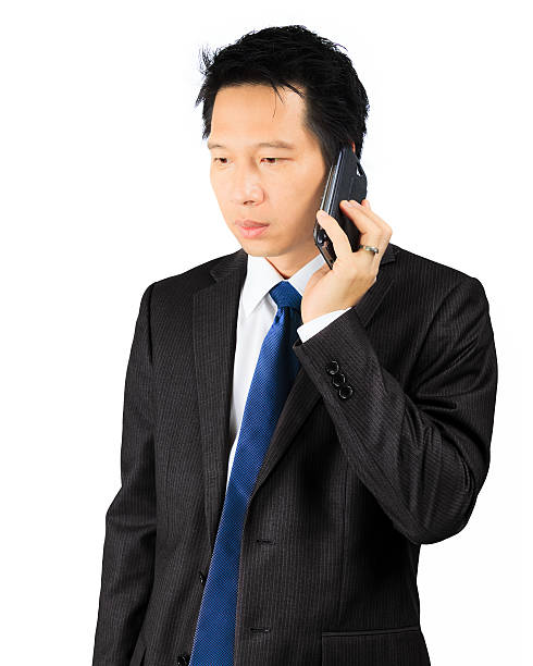 istock Asian business man makes a phone call 179811234