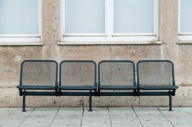 istock black benches on sidewalk in front of building with windows 1798112660