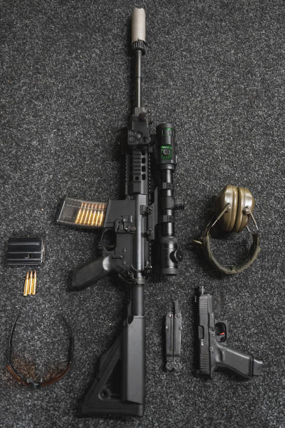 An M4 assault rifle fitted with an ACOG scope and sound suppressor. This configuration is used by American forces in Afghanistan.