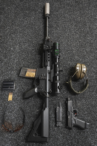 Modern tactical weapon, rifle with optical sight with night vision, silencer and pistol. High quality photo