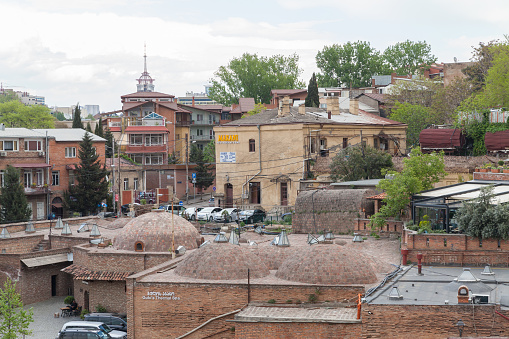 Tbilisi, Georgia - April 28, 2019: Old Tbilisi I. Grishashvili street view with Marani Restaurant And Bar and Thermal Spa Baths