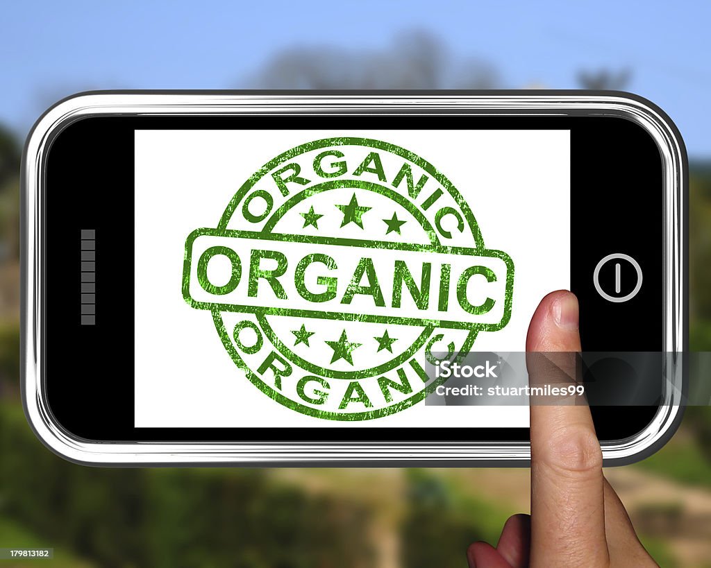 Organic On Smartphone Shows Ecological Products Organic On Smartphone Shows Ecological Products Or Natural Food Certificate Stock Photo