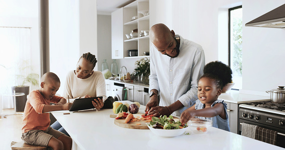 Family, kitchen or cook or homework child tablet, healthy dinner or happy house. Black father, daughter or prepare food vegetables ingredients for nutrition fibre diet, together and home bonding love