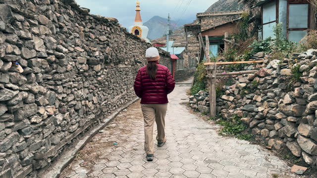 Women walking in old town village