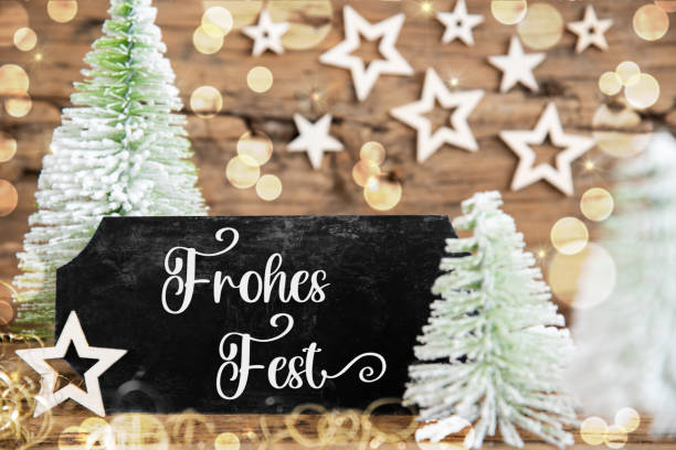 Green White Christmas Trees With Wooden Rustic Background And A Black Sign With German Text Frohes Fest, Which Means Happy Holidays In English