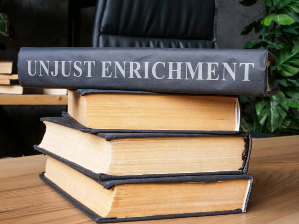 istock Stack of books with a law about unjust enrichment on it. 1798184811