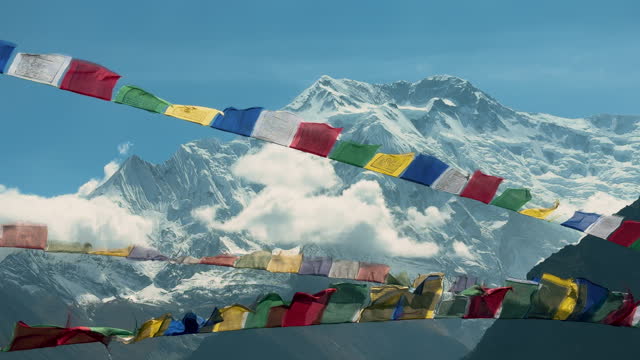 Prayer flag with Annapurna 2 mountain range background