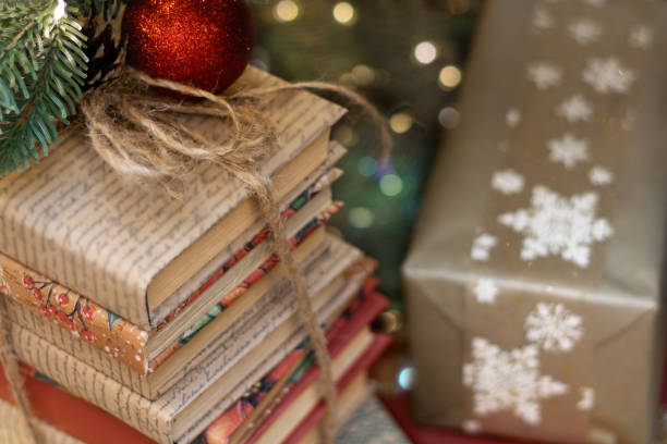 Gifts and books under Christmas tree. Boxing Day